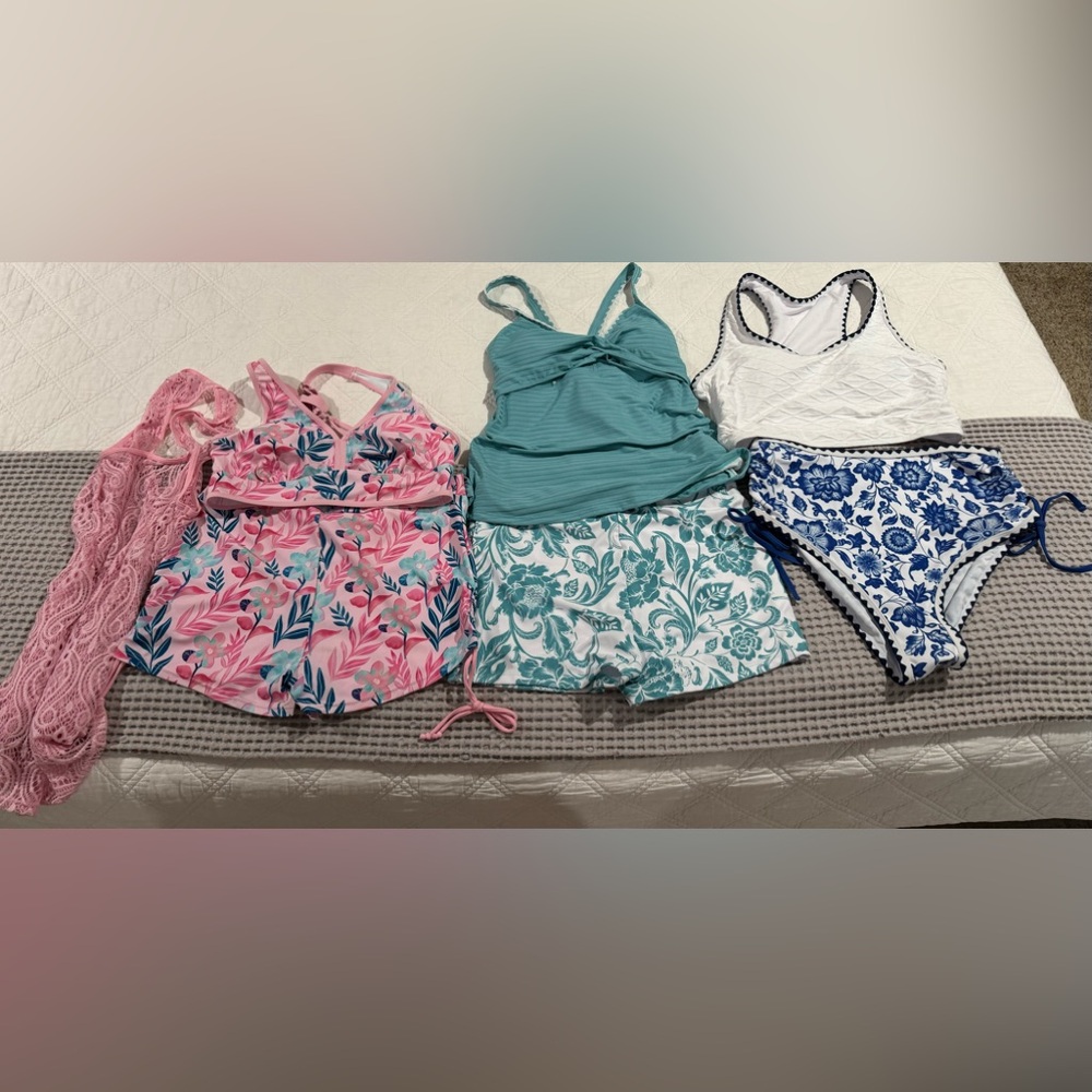3 Large New never worn Swimsuits from Modlilly . All 3 still have hygiene strips